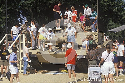 People Looking at Military Tank