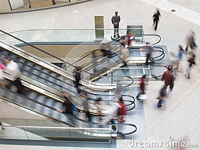 People moving on an Escalator