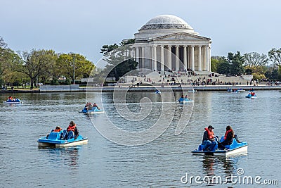 People in Paddle Boats in the Lake in front of the