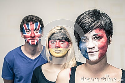 People with painted European flags on faces