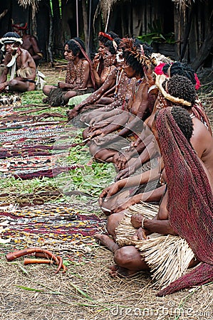 People of Papuan tribal sell traditional souvenirs