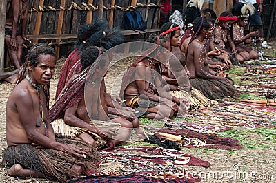 People of Papuan tribal sell traditional souvenirs