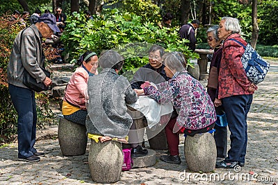 People playing cards in park shanghai china