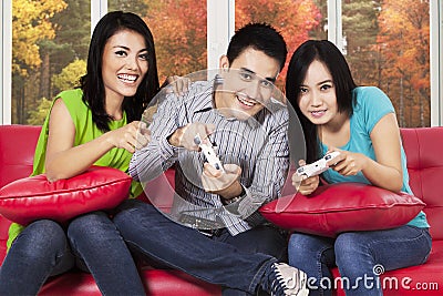 People playing game console at home