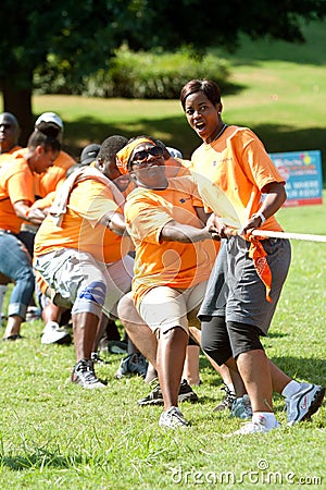 People Pull Rope In Team Tug-Of-War Competition