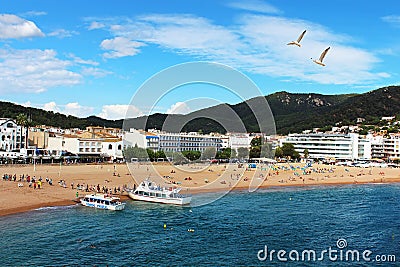 People are resting in european village Tossa de Mar