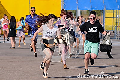 People run to catch the first row after buying their tickets at FIB Festival