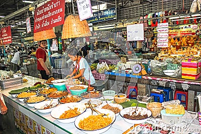 People selling food at traditional market, thailandia