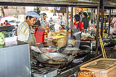 People selling food at traditional market, thailandia
