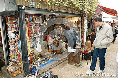 People shopping at the flea market of Clignancourt at Paris