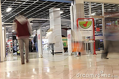 People shopping in future shop store with motion blur