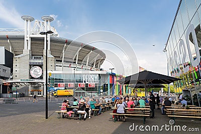 People sitting at a terrace near a Dutch soccer stadium in Amsterdam