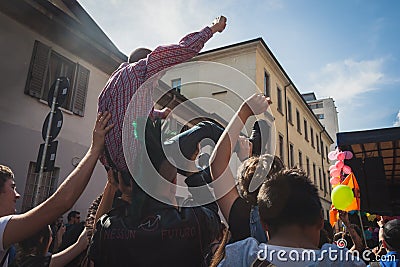 People taking part in Mayday parade in Milan, Italy