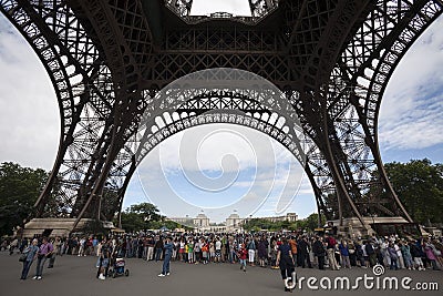 People and tourists visit Eiffel Tower in Paris