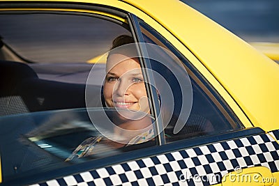 People travelling-business woman in yellow taxi