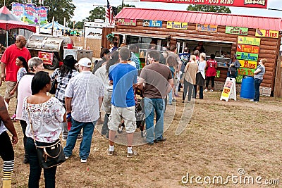 People Wait In Long Line To Buy Food At Fair