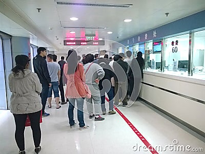 People waiting at hospital registration