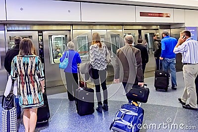 People waiting for the terminal tram at airport