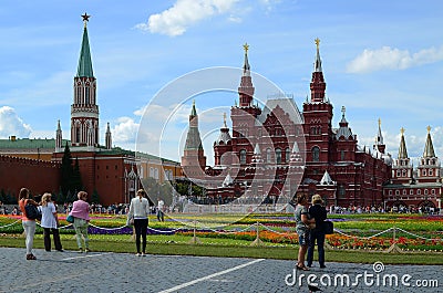 People walk along Red Square in a holiday