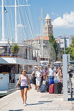 People walk on the pier