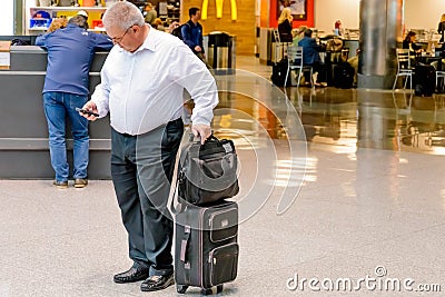 People walking with luggage in an airport