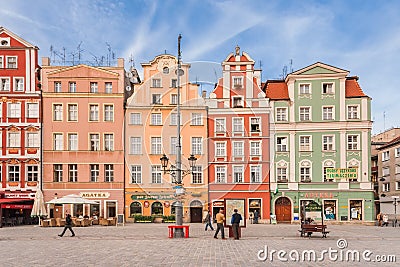 People walking on Main Market Square in Wroclaw.