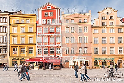 People walking on Main Market Square in Wroclaw.