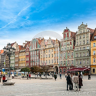 People walking on Main Market Square in Wroclaw.