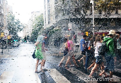 People walking in the rain in the city