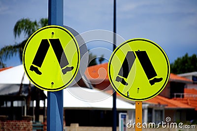 People walking safety sign post