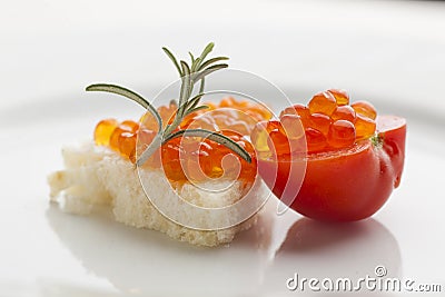 Perfect breakfast - Caviar sandwich with red cherry tomato on pl