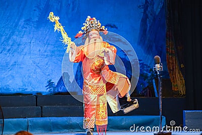 Performer performing traditional Chinese opera on the Chinese ghost festival.