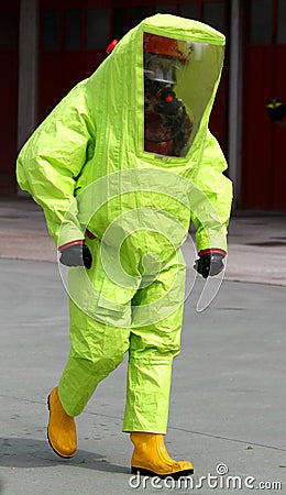 Person with anti radiation suit yellow and yellow rubber boots t