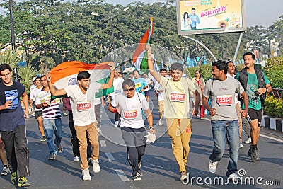 Person holding Indian Flag, Hyderabad 10K Run Event