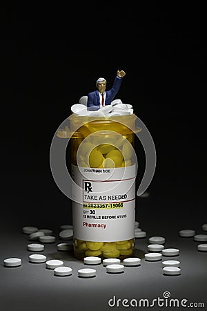 Pharmaceutical CEO with prescription pills and bottle, vertical