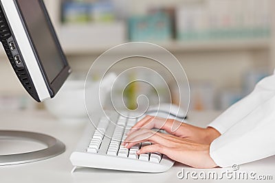 Pharmacist s Hands Typing On Computer Keyboard