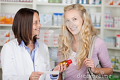 Pharmacist And Young Blond Female Customer