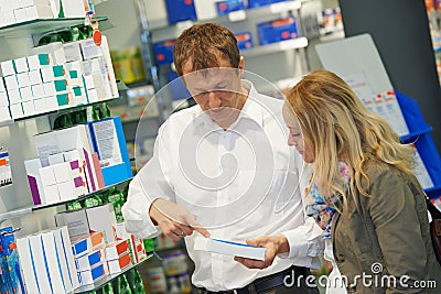 Pharmacy chemist workers in drugstore