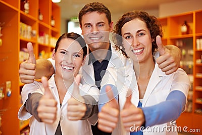 Pharmacy team holding thumbs up