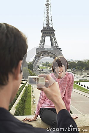 Photographing In Front Of Eiffel Tower