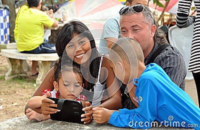 Phuket, Thailand: Family with Electronic Pad