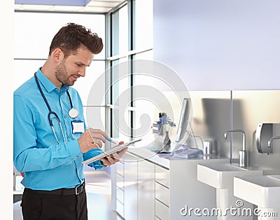 Physician working with tablet in doctors office