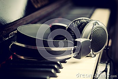 Piano keyboard and headphones