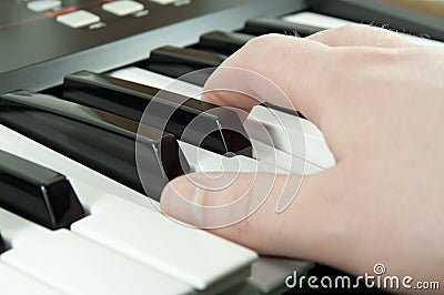 Piano keys with hand