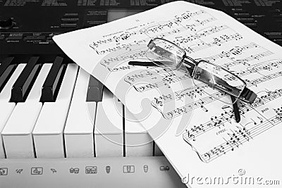 Piano sheet music and glasses