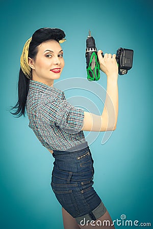 Picture of beautiful pin up woman with tool