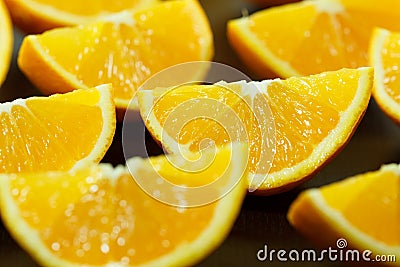 Pieces of orange on a black plate