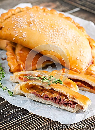 Pies with meat and cheese