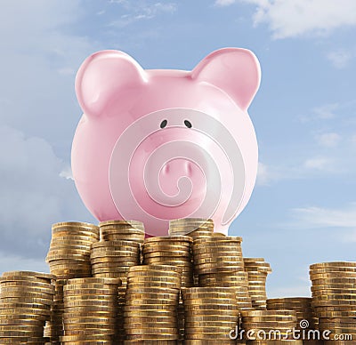 Piggy bank on golden coin