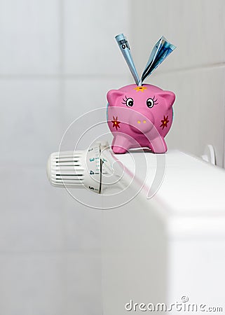 Piggy bank with radiator thermostat saving heating costs